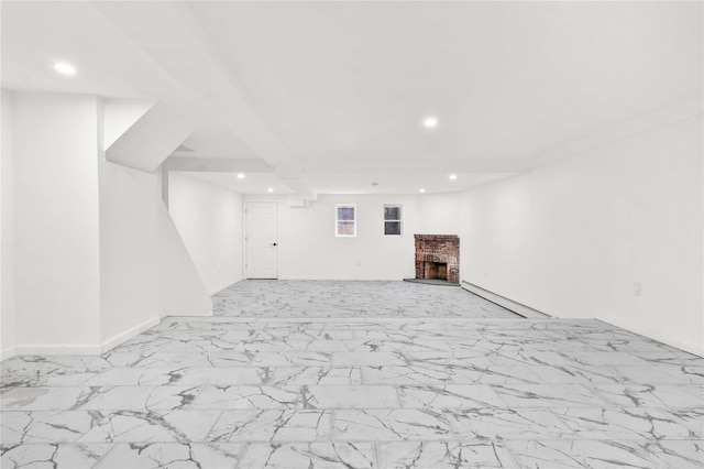 179-55 Anderson Rd, Jamaica, NY 11434 - finished basement with recessed lighting, baseboards, marble finish floor, and a brick fireplace