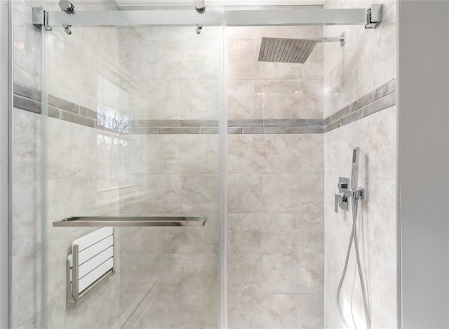 bathroom with a shower stall