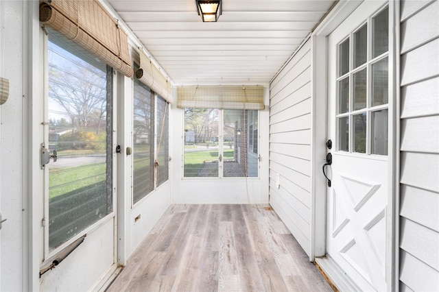unfurnished sunroom featuring plenty of natural light