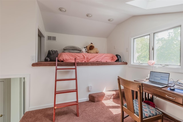 bedroom featuring vaulted ceiling with skylight, carpet floors, and visible vents