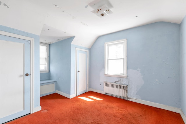 444 W Olive St, Long Beach, NY 11561 - additional living space with carpet floors, baseboards, lofted ceiling, and radiator