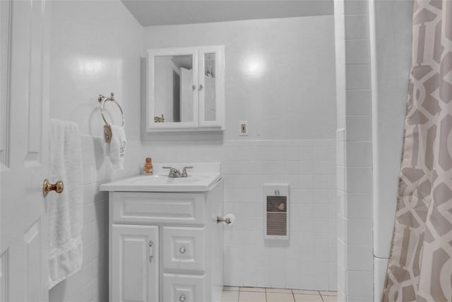 176 Jackson Ave, Syosset, NY 11791 - bathroom with vanity, tile patterned floors, tile walls, and a shower with shower curtain