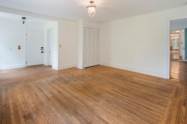 27 Bedford Rd, Pleasantville, NY 10570 - unfurnished room featuring a chandelier, light wood-type flooring, and a smoke detector