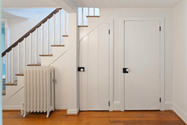 27 Bedford Rd, Pleasantville, NY 10570 - stairs with radiator and wood finished floors