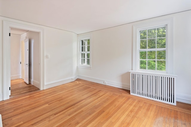 27 Bedford Rd, Pleasantville, NY 10570 - unfurnished room featuring radiator and wood-type flooring