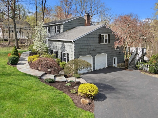 8 Richard Somers Rd, Granite Springs, NY 10527 - view of side of home featuring a chimney, a yard, a garage, a shingled roof, and aphalt driveway