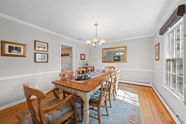 8 Richard Somers Rd, Granite Springs, NY 10527 - dining room featuring a baseboard heating unit, a notable chandelier, light wood-style flooring, and ornamental molding