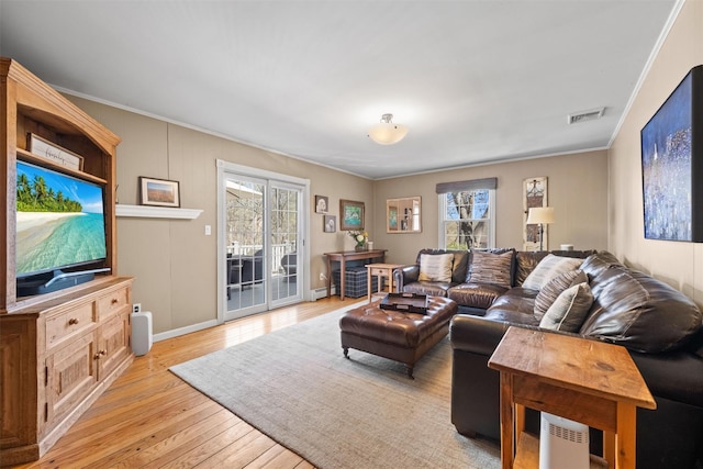 8 Richard Somers Rd, Granite Springs, NY 10527 - living room featuring a healthy amount of sunlight, ornamental molding, light wood-type flooring, and visible vents
