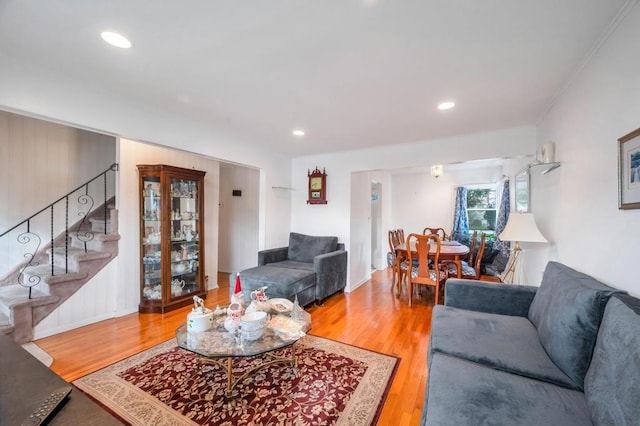 living room featuring stairway, wood finished floors, and recessed lighting