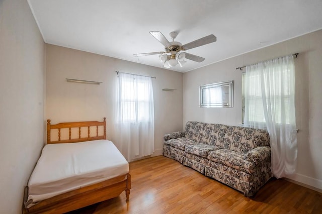 bedroom featuring a ceiling fan and light wood finished floors