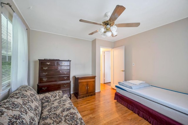 bedroom with ceiling fan and light wood finished floors