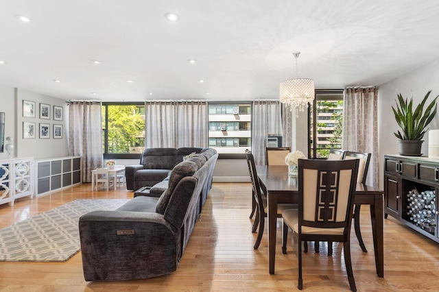 dining space featuring recessed lighting and light wood-style flooring
