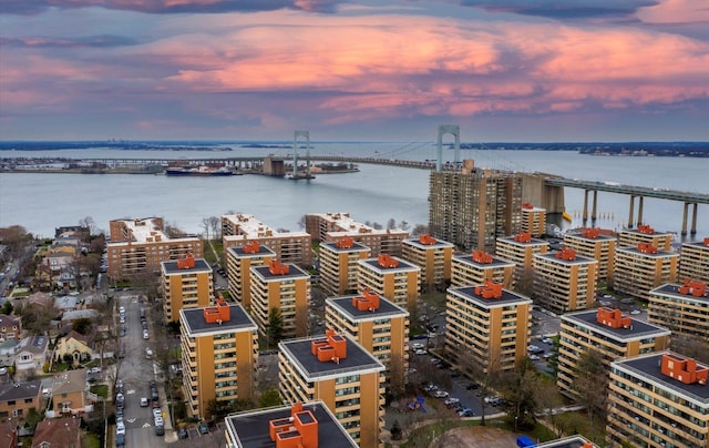 aerial view at dusk with a water view