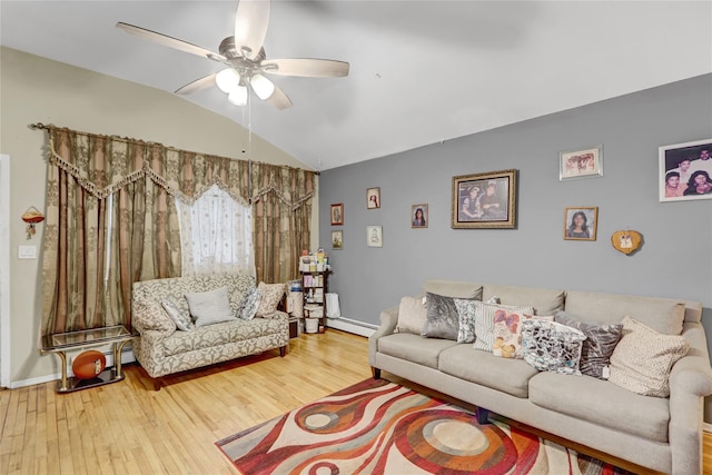 living room with a ceiling fan, wood finished floors, and vaulted ceiling