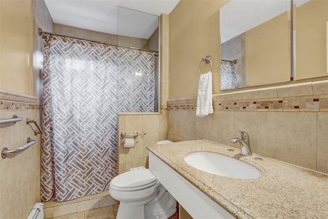 bathroom featuring a sink, toilet, a shower with shower curtain, tile walls, and a baseboard radiator