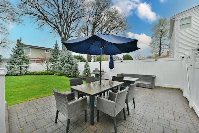 view of patio / terrace featuring outdoor dining space, area for grilling, and a fenced backyard