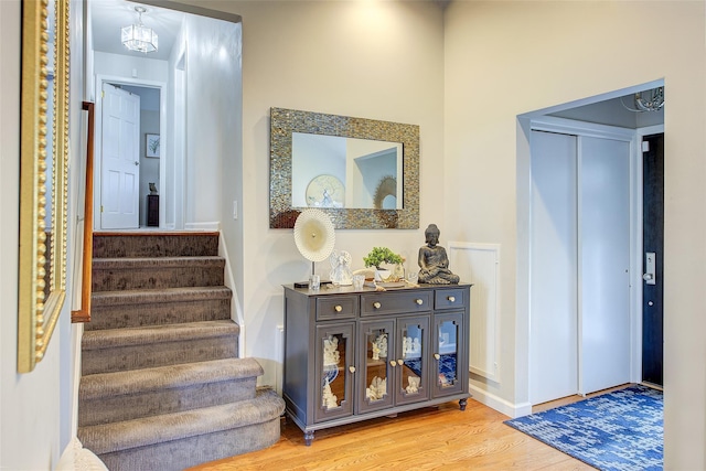 hall featuring stairway and wood finished floors