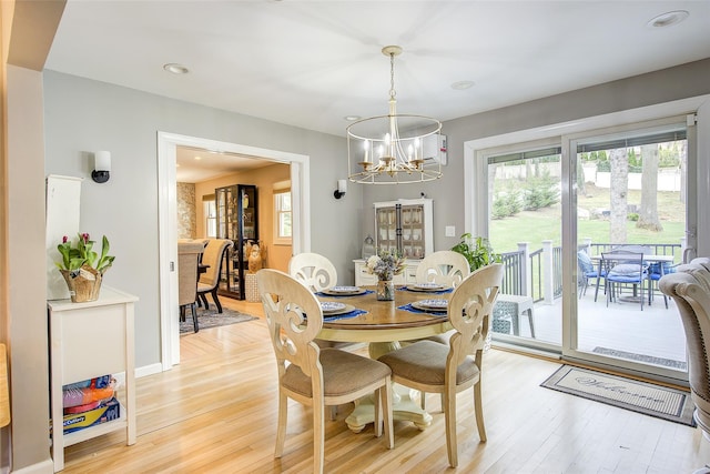 dining area featuring recessed lighting, baseboards, a chandelier, and light wood-style flooring