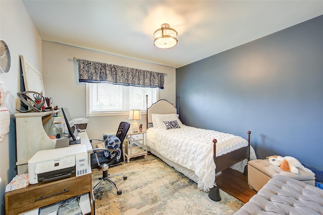 bedroom with wood finished floors