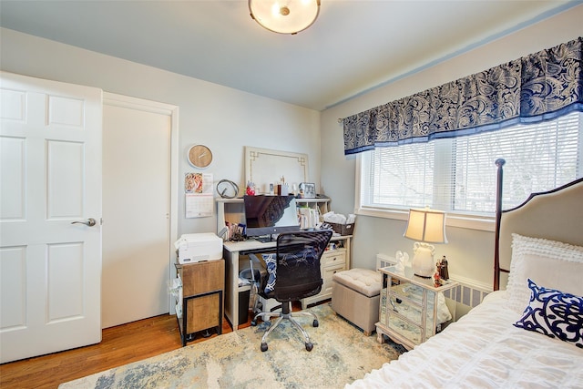 bedroom featuring wood finished floors