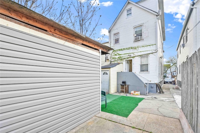 109-55 Lefferts Blvd, South Ozone Park, NY 11419 - back of property with a patio area and cooling unit