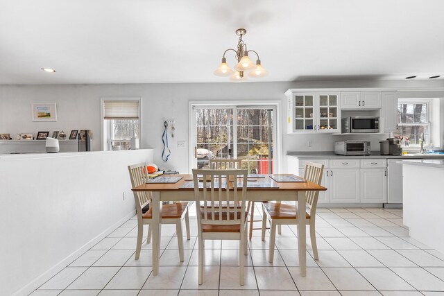 dining space featuring an inviting chandelier, recessed lighting, a toaster, and a healthy amount of sunlight