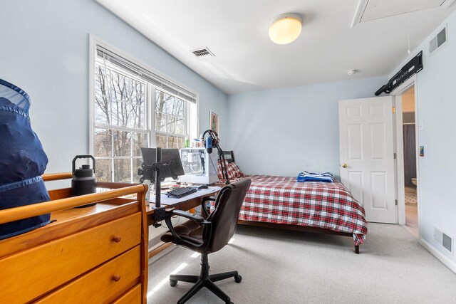 bedroom featuring visible vents, attic access, and carpet flooring