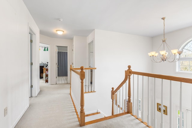 8 Killian Ln, Brewster, NY 10509 - corridor with an upstairs landing, a chandelier, and light carpet