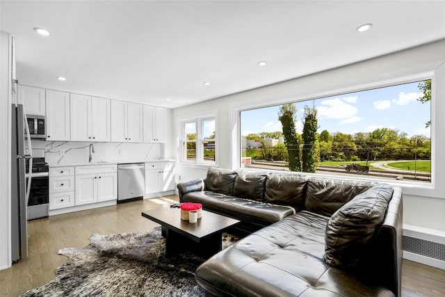 120 Loomis Ave, Yonkers, NY 10704 - living area featuring light wood-type flooring and recessed lighting