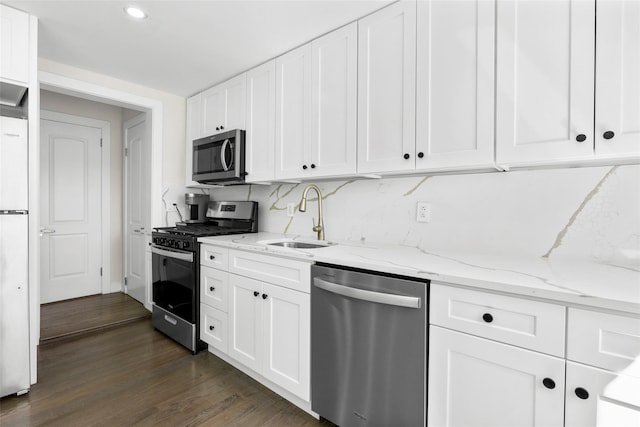 120 Loomis Ave, Yonkers, NY 10704 - kitchen with stainless steel appliances, a sink, white cabinetry, dark wood-style floors, and light stone counters