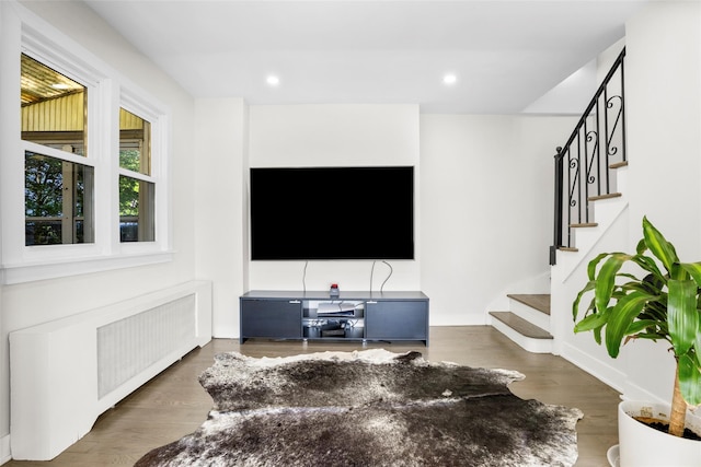 120 Loomis Ave, Yonkers, NY 10704 - living area featuring stairway, wood finished floors, recessed lighting, and radiator