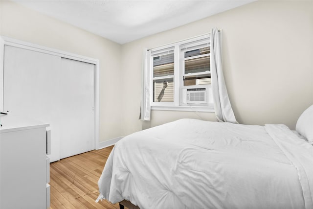 120 Loomis Ave, Yonkers, NY 10704 - bedroom featuring light wood-style flooring, cooling unit, and a closet