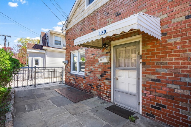 120 Loomis Ave, Yonkers, NY 10704 - property entrance with fence and brick siding