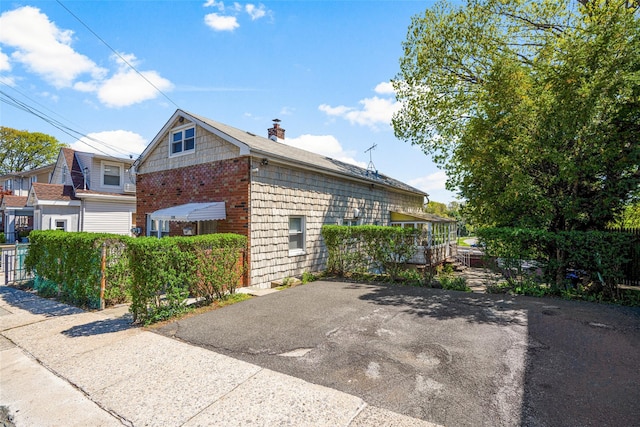 120 Loomis Ave, Yonkers, NY 10704 - view of side of home featuring a chimney