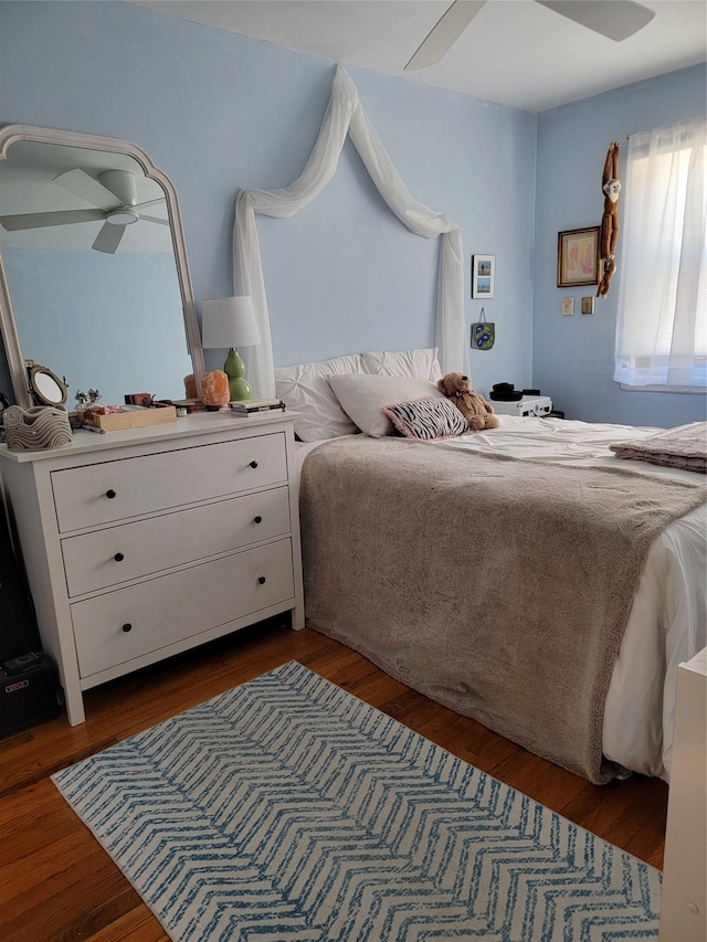 bedroom featuring dark wood finished floors
