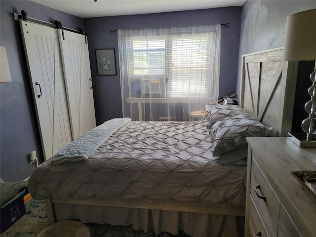 bedroom with a barn door