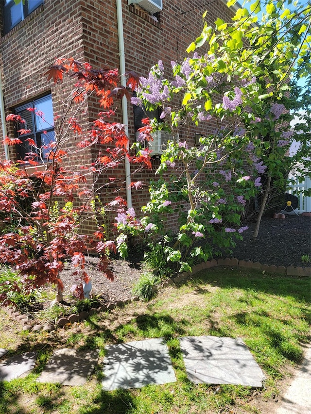 view of side of property with brick siding