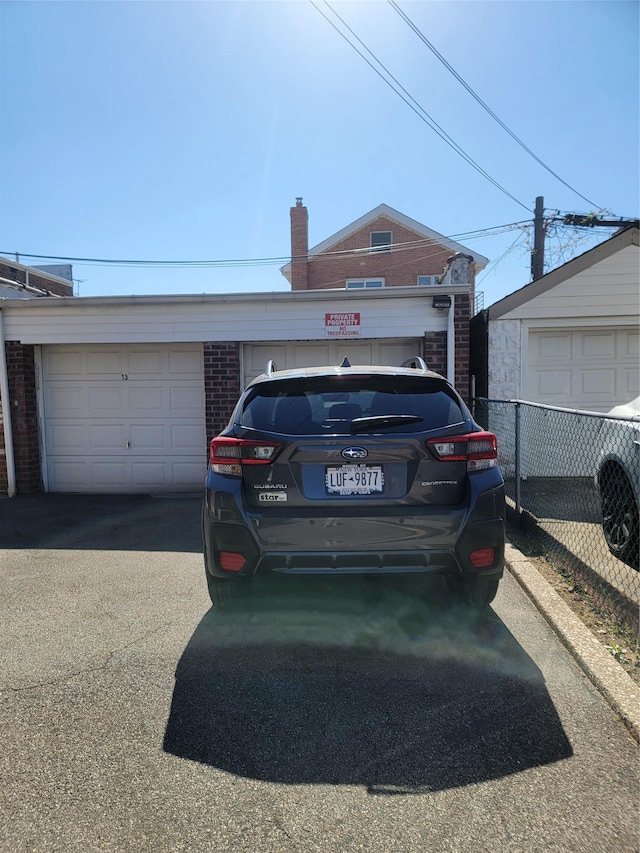 garage featuring fence