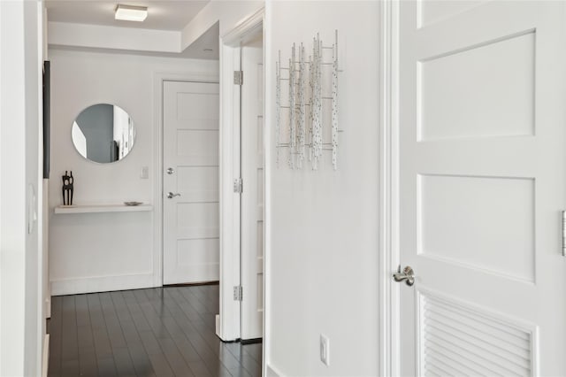 corridor with dark wood-style floors