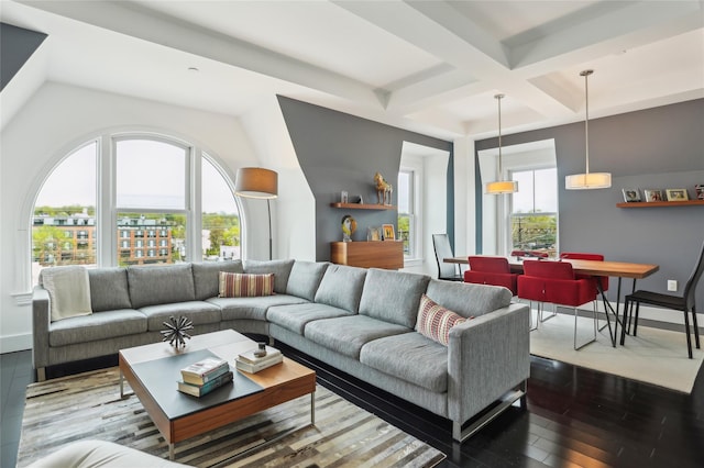 living room featuring baseboards, coffered ceiling, hardwood / wood-style flooring, and beam ceiling