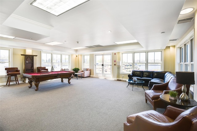 playroom featuring pool table, plenty of natural light, a tray ceiling, and carpet floors