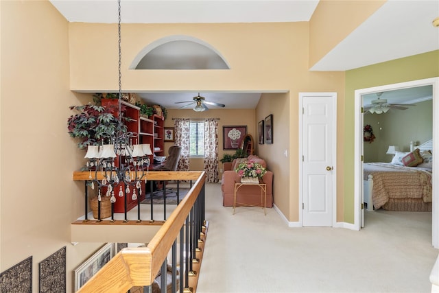 hall with carpet floors and baseboards