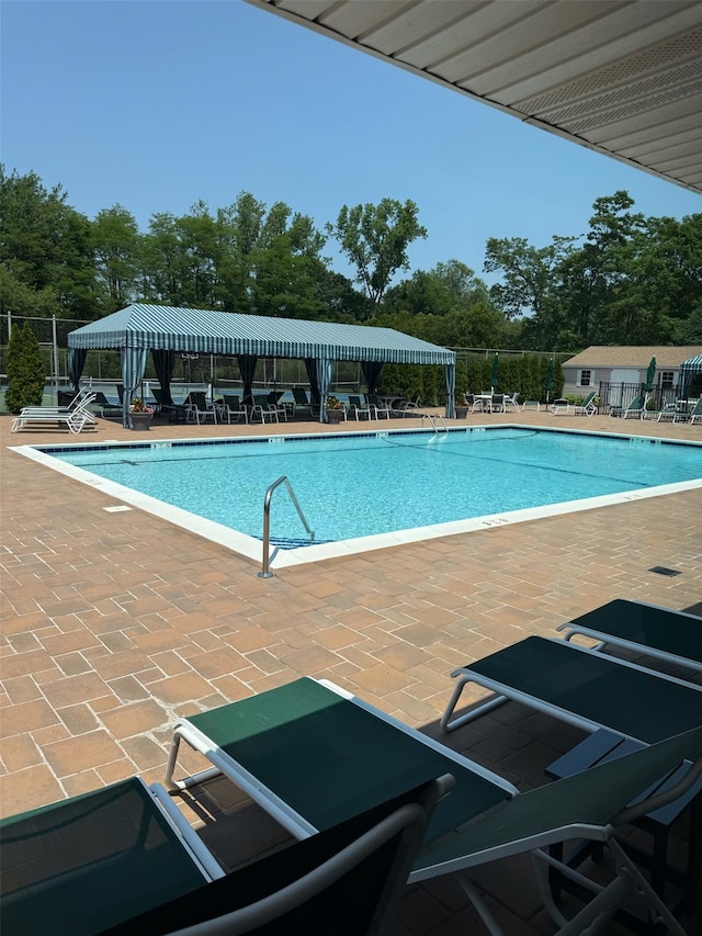 108 Hidden Ponds Cir, Smithtown, NY 11787 - community pool featuring a patio and view of scattered trees