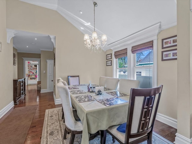 565 Baldwin Ave, North Baldwin, NY 11510 - dining area with an inviting chandelier, baseboards, ornamental molding, and dark wood-type flooring