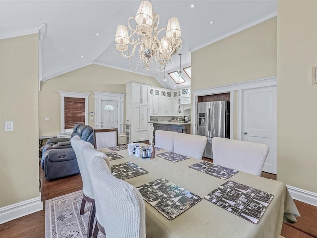 565 Baldwin Ave, North Baldwin, NY 11510 - dining space with baseboards, a chandelier, lofted ceiling, and dark wood-type flooring