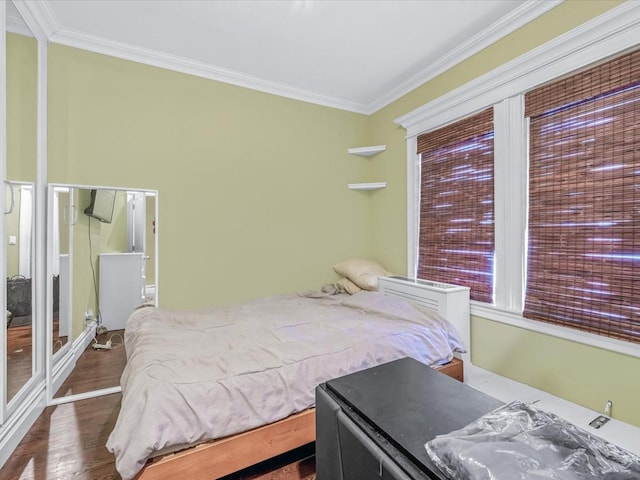 565 Baldwin Ave, North Baldwin, NY 11510 - bedroom featuring crown molding and wood finished floors