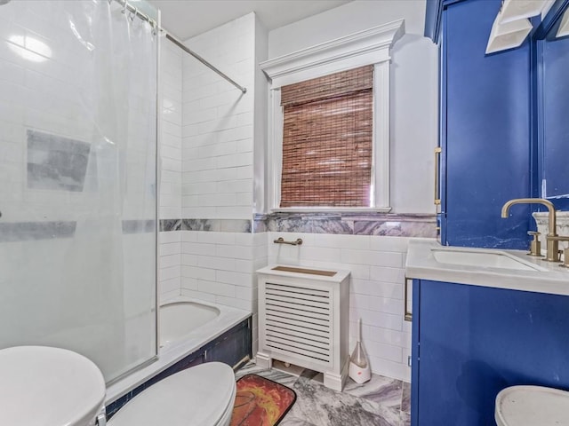 565 Baldwin Ave, North Baldwin, NY 11510 - full bathroom featuring tile walls, vanity, toilet, and shower / tub combo with curtain