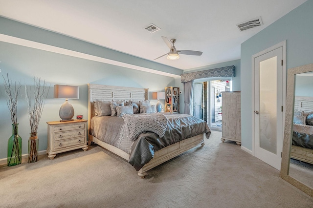 carpeted bedroom with a ceiling fan, baseboards, visible vents, and access to exterior