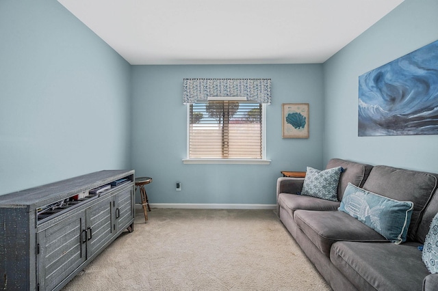 living room with baseboards and light colored carpet