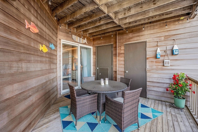 wooden deck featuring outdoor dining space